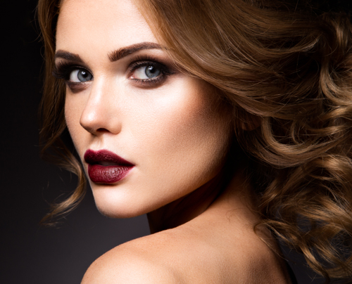 Close-up portrait of beautiful woman with bright make-up