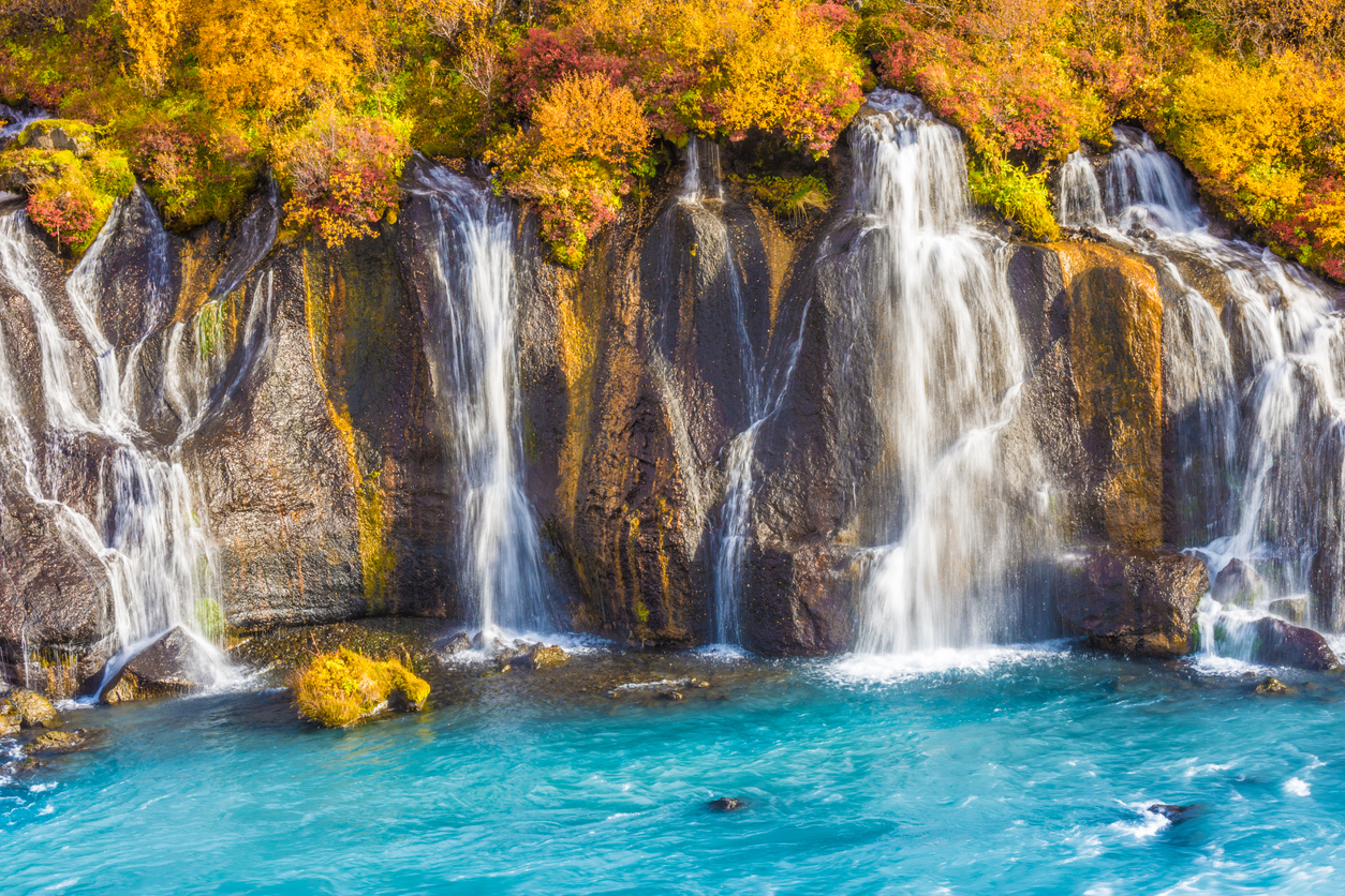 Hraunfossar (Borgarfjordur, western Iceland), a series of waterfalls formed by rivulets streaming out of the Hallmundarhraun lava field which flowed from an eruption of one of the volcanoes lying under the glacier LangjÃ¶kull. The waterfalls pour into the HvÃ­tÃ¡ river.